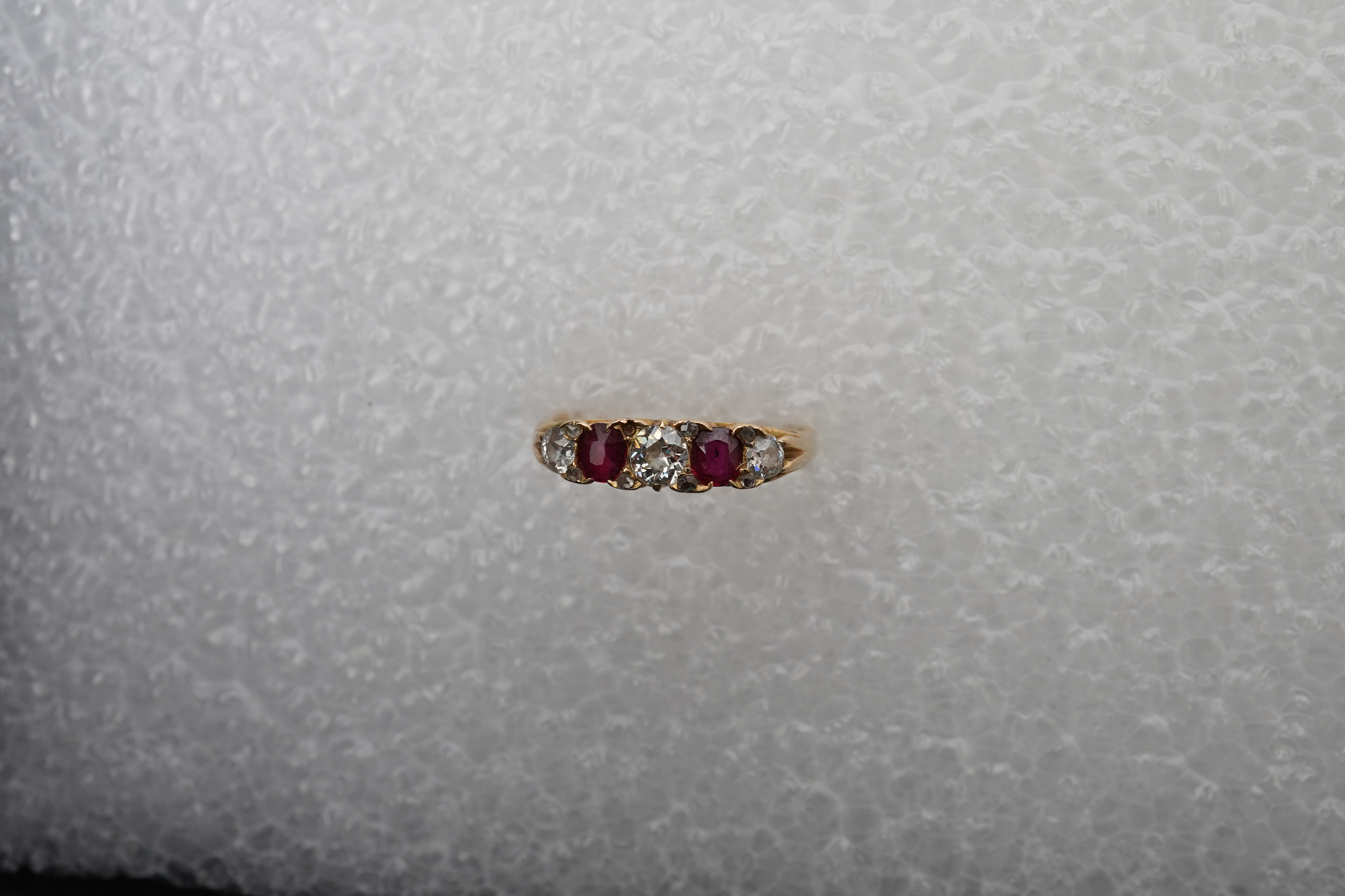A ruby and diamond five-stone ring, early 20th century